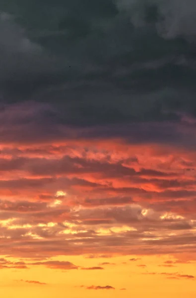 Clouds Swirling Backlit Setting Sun —  Fotos de Stock