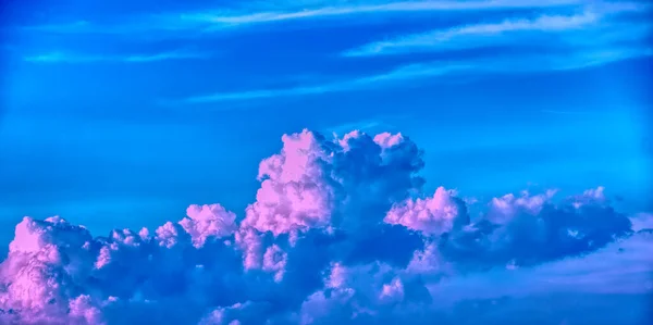 Swirling Evening Clouds Illuminated Setting Sun 免版税图库图片