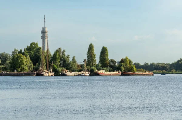 Recreational lake Mooie Nel in Spaarnwoude with a view on telecommunication tower