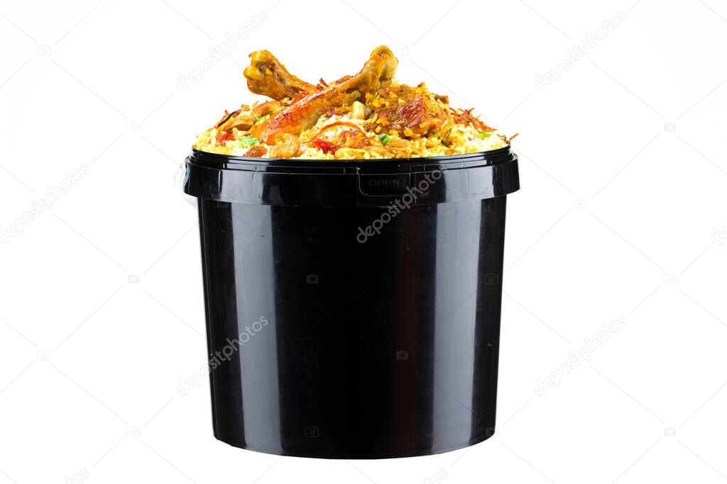 Chicken Bucket Biryani, Kerala dum chicken biryani arranged in a black bucket container with white textured background.