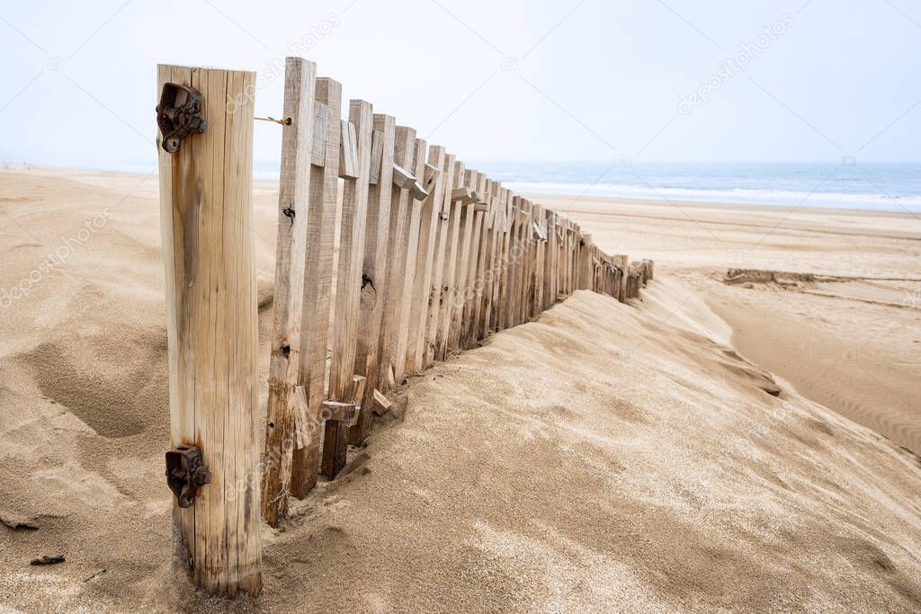 close up Wooden fence on the beach to contain windblown sand