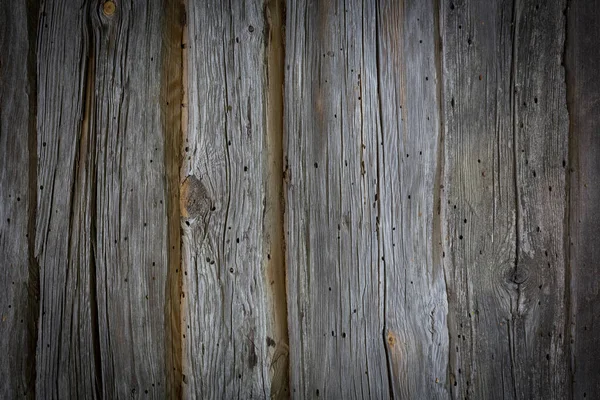 Troncos de madera de una casa vieja. Primer plano. Textura de madera gris natural envejecida. Antecedentes Fotografía horizontal. — Foto de Stock