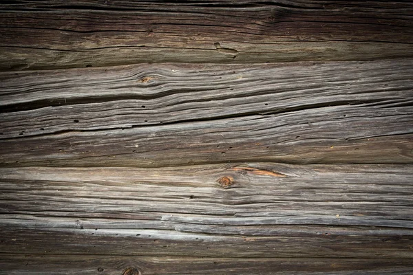 Troncos de madera de una casa vieja. Primer plano. Textura de madera gris natural envejecida. Antecedentes Fotografía horizontal. — Foto de Stock