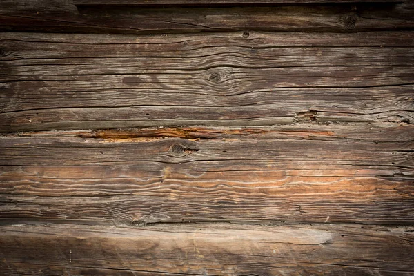 Troncos de madera de una casa vieja. Textura de madera gris natural envejecida. Contexto. — Foto de Stock