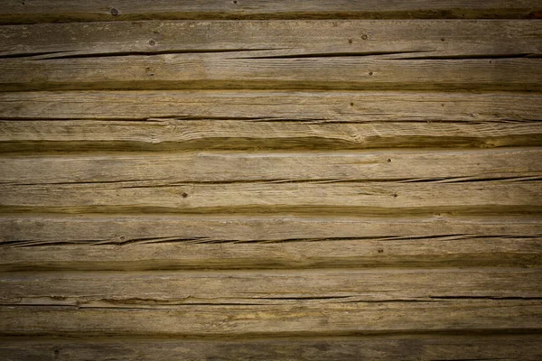 Troncos de madera de una casa vieja. Primer plano. Textura de madera gris natural envejecida. Antecedentes Fotografía horizontal — Foto de Stock