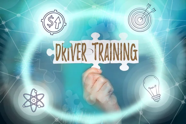 Hand writing sign Driver Training. Internet Concept course of study that teaches how to drive a vehicle Hand Holding Jigsaw Puzzle Piece Unlocking New Futuristic Technologies.