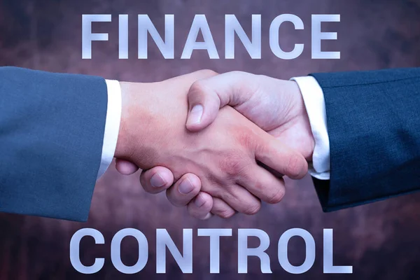 Conceptual caption Finance Control. Business idea procedures that are implemented to manage finances Two Professional Well-Dressed Corporate Businessmen Handshake Indoors — Stock Photo, Image