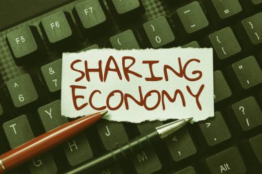 Metin başlığı Paylaşım Ekonomisini sunar. Çevrimiçi Günlükler Yaratmak, Yeni Yazılar Yazmak, Yeni Manşetler Yapmaya dayalı iş yaklaşımı ekonomik modeli