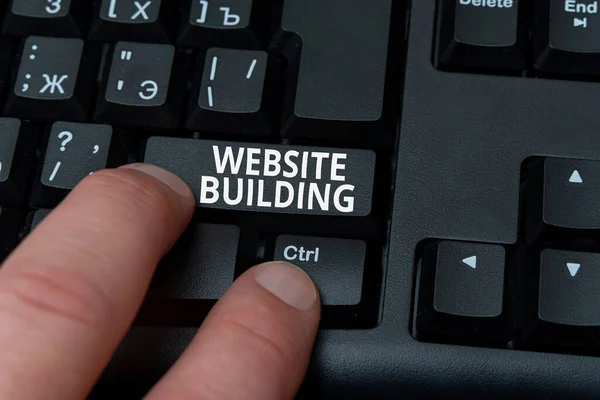 Text sign showing Website Building. Internet Concept tools that typically allow the construction of pages Hands Pointing Pressing Computer Keyboard Keys Typewriting New Ideas. — Stock Photo, Image