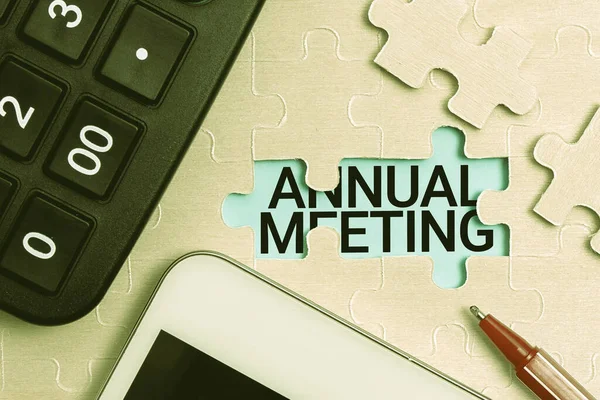 Text sign showing Annual Meeting. Concept meaning Yearly gathering of an organization interested shareholders Building An Unfinished White Jigsaw Pattern Puzzle With Missing Last Piece