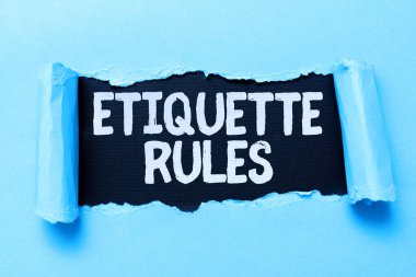 İlham, işaret görgü kurallarını gösteriyor. Sosyal gruplarda kabul edilen davranışları kontrol eden iş dünyası adetleri. Kağıt üzerinde yırtılma ön tarafın arkasındaki arka planı ortaya çıkarır.