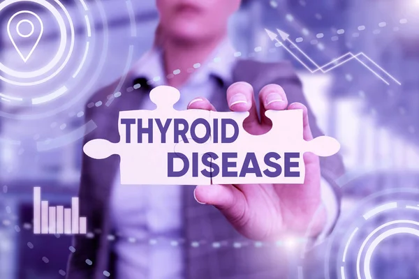 Text showing inspiration Thyroid Disease. Internet Concept the thyroid gland fails to produce enough hormones Business Woman Holding Jigsaw Puzzle Piece Unlocking New Futuristic Tech.