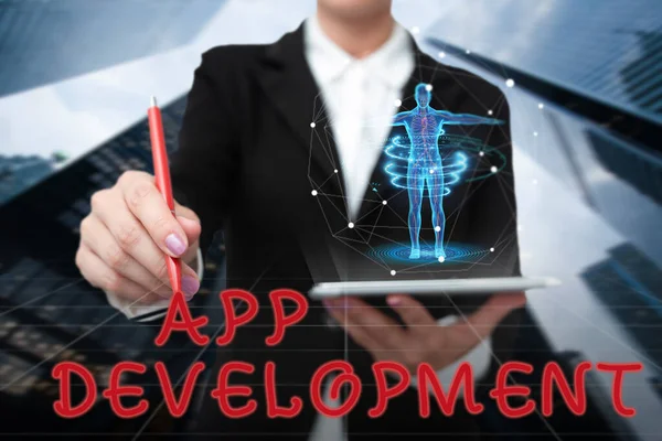 Υπογραφή εμφάνισης App Development. Επιχειρηματικές ιδέες Υπηρεσίες ανάπτυξης για φοβερό κινητό και web εμπειρίες Lady In Uniform Standing Holding Tablet Typing Futuristic Technologies. — Φωτογραφία Αρχείου