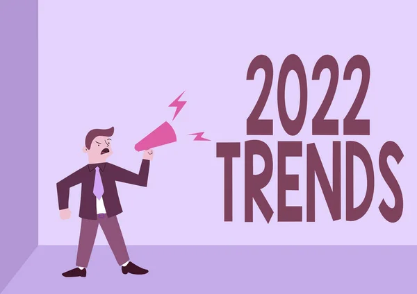 El yazısı işareti 2022 Trends. Bir şeyin gelişmekte ya da değişmekte olduğu iş genel bakış açısı. Megafonun üzerinde duran adam yeni duyuruyu sunuyor.. — Stok fotoğraf