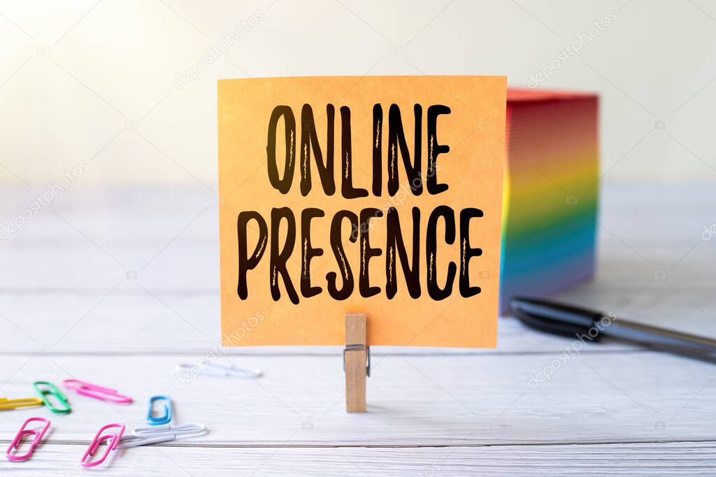 Handwriting text Online Presence. Business showcase existence of someone that can be found via an online search Blank Sticky Note Laundry Clip Stack Of Colorful Paper Pen Placed On Desk.