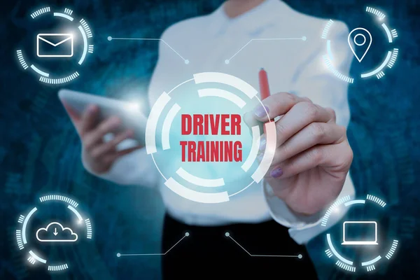 Hand writing sign Driver Training. Business approach course of study that teaches how to drive a vehicle Lady In Uniform Holding Tablet In Hand Virtually Typing Futuristic Tech.