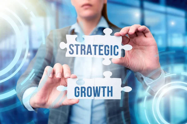 Bildunterschrift: Strategisches Wachstum. Word Written on create plan or plan to increase stocks or Verbesserung Business Woman Holding Jigsaw Puzzle Piece Freischaltung New Futuristic Tech. — Stockfoto