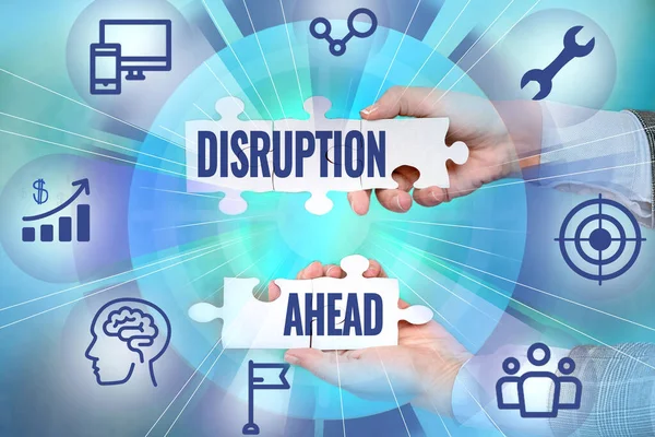 Text caption presenting Disruption Ahead. Internet Concept Transformation that is caused by emerging technology Hand Holding Jigsaw Puzzle Piece Unlocking New Futuristic Technologies.