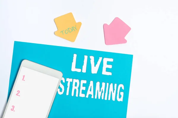 Writing displaying text Live Streaming. Word Written on Transmit live video coverage of an event over the Internet Display of Different Color Sticker Notes Arranged On flatlay Lay Background
