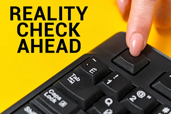 Sign displaying Reality Check Ahead. Conceptual photo makes them recognize truth about situations or difficulties Hands pointing pressing computer keyboard keys typewriting new ideas.