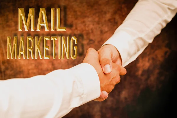 Konceptuální zobrazení Mail Marketing. Word Written on Act of sending a commercial messages Broadcast sense Two Professional Well-Dressed Corporate Businessmen Handshake Indoors — Stock fotografie