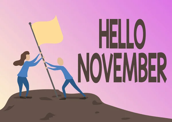 Conceptual caption Hello November. Business showcase Welcome the eleventh month of the year Month before December Man And Woman Drawing Standing Setting Up Flag On Peak Of Mountain.
