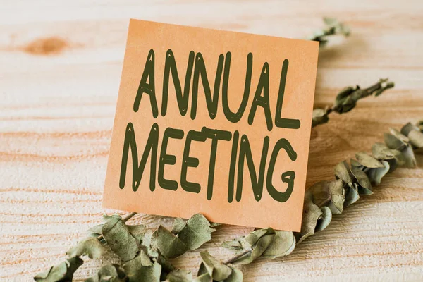 Hand writing sign Annual Meeting. Concept meaning Yearly gathering of an organization interested shareholders Piece Of Blank Square Note Surrounded By Laundry Clips Showing New Idea.