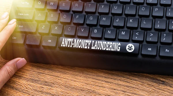 Handwriting text Anti Money Laundering. Concept meaning regulations stop generating income through illegal actions Hands Pointing Pressing Computer Keyboard Keys Typewriting New Ideas.