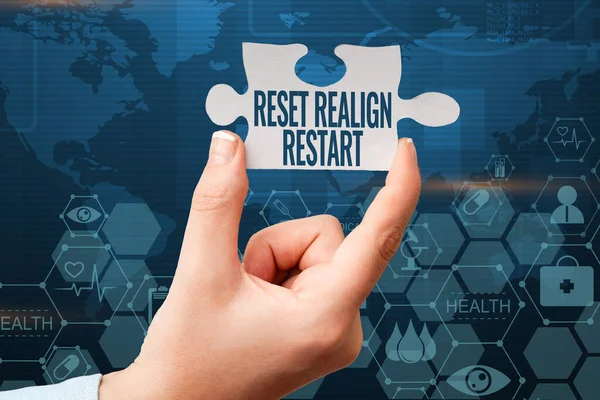 Text showing inspiration Reset Realign Restart. Internet Concept Life audit will help you put things in perspectives Hand Holding Jigsaw Puzzle Piece Unlocking New Futuristic Technologies.
