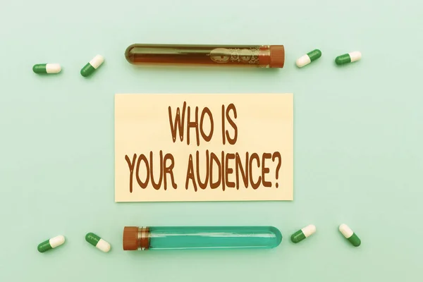 Text sign showing Who Is Your Audience Question. Concept meaning who is watching or listening to it Prescribed Medicine Vitamines And Minerals Pills And Medical Supplies