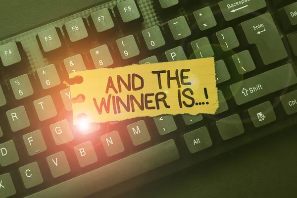 Hand writing sign And The Winner Is. Business overview announcing who got first place at competition or exam Connecting With Online Friends, Making Acquaintances On The Internet — Stock Photo, Image