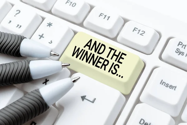 Text showing inspiration And The Winner Is. Internet Concept announcing who got first place at competition or exam Typing Online Member Name Lists, Creating New Worksheet Files — Stock Photo, Image