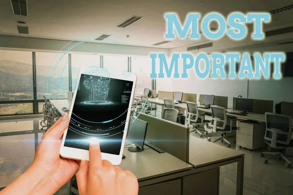 Text showing inspiration Most Important. Business overview Greatest or highest degree quantity or the like Significant Hands Holding A Mobile Phone In Laboratory Showing Futuristic Technology. — Stock Photo, Image