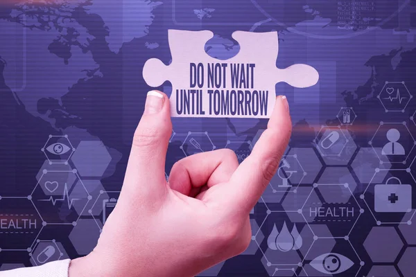 Text sign showing Do Not Wait Until Tomorrow. Business approach needed to do it right away Urgent Better do now Hand Holding Jigsaw Puzzle Piece Unlocking New Futuristic Technologies.