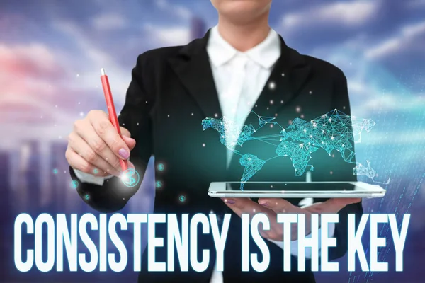 Sign displaying Consistency Is The Key. Business overview by Breaking Bad Habits and Forming Good Ones Lady In Uniform Standing Holding Tablet Typing Futuristic Technologies. — Stock Photo, Image