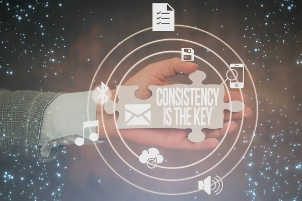 Sign displaying Consistency Is The Key. Word for by Breaking Bad Habits and Forming Good Ones Hand Holding Jigsaw Puzzle Piece Unlocking New Futuristic Technologies. — Stock Photo, Image