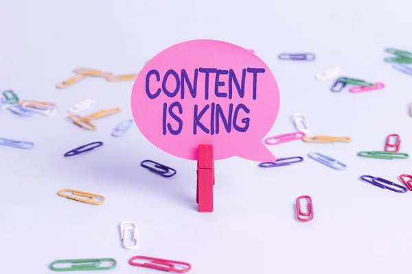 Conceptual caption Content Is King. Business overview marketing focused growing visibility non paid search results Colorful Office Supplies Bright Workplace Stuff Workshop Materials