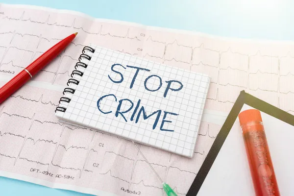 Conceptual caption Stop Crime. Conceptual photo the effort or attempt to reduce and deter crime and criminals Reading Graph And Writing Important Medical Notes Test Result Analysis — Stock Photo, Image