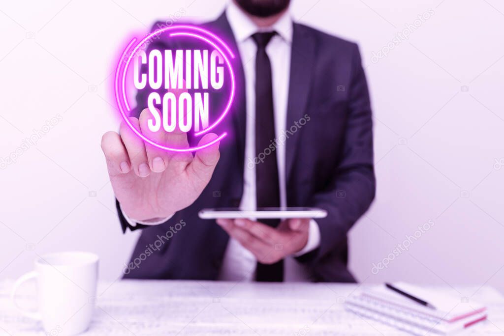 Writing displaying text Coming Soon. Business concept event or action that will happen after really short time Presenting Communication Technology Smartphone Voice And Video Calling