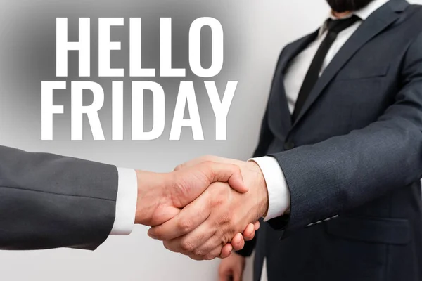 Text sign showing Hello Friday. Internet Concept used to express happiness from beginning of fresh week Two Professional Well-Dressed Corporate Businessmen Handshake Indoors