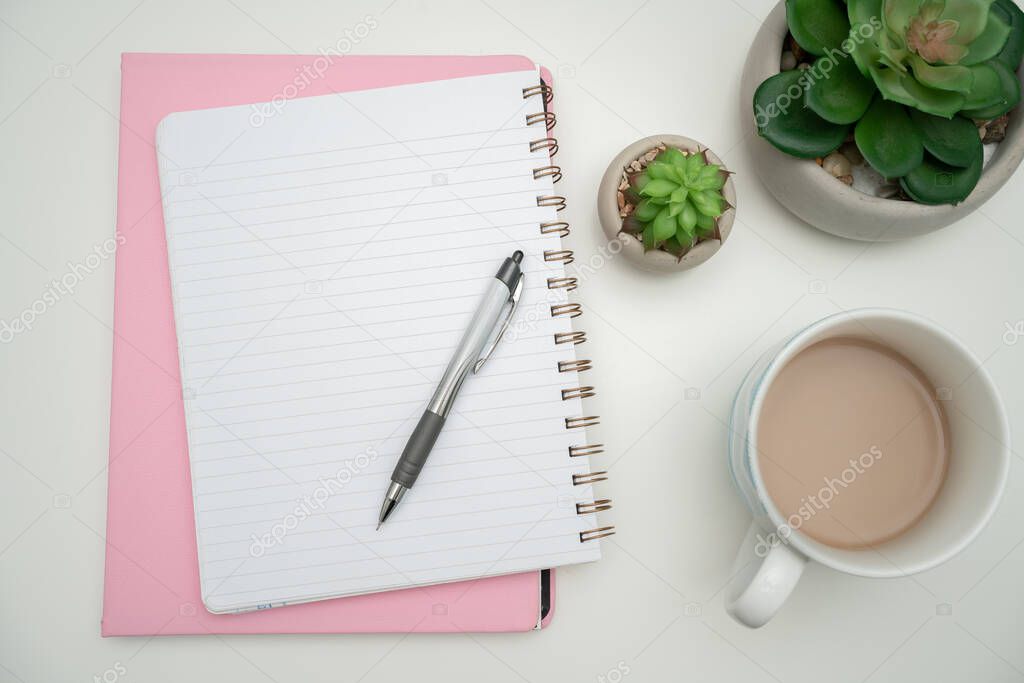 Office Supplies Over Desk With Keyboard And Glasses And Coffee Cup For Working Remotely, Assorted School Utilities For Studying With Hot Drink And Eyeglasses.