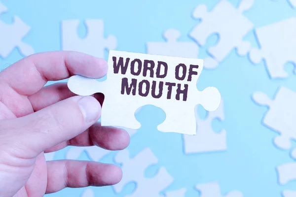 Inspiration showing sign Word Of Mouth. Business idea information that is transmitted without being written down Building An Unfinished White Jigsaw Pattern Puzzle With Missing Last Piece Royalty Free Stock Images