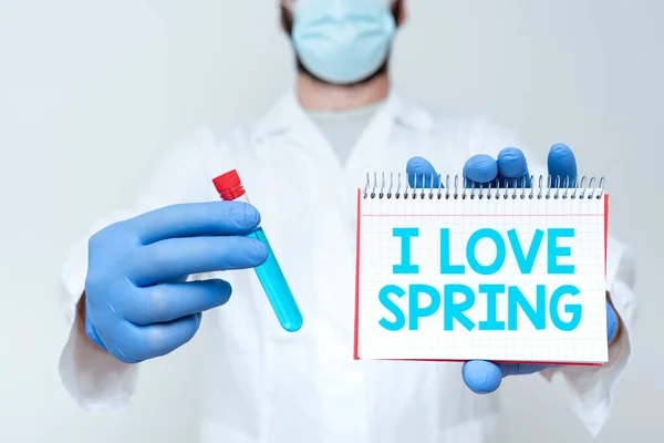 Текст підпису, що представляє "Я люблю весну". Бізнес-концепція, що розповідає, чому сильна прихильність до цього сезону Хімік відображає формулу медицини, представляючи лабораторні дослідження — стокове фото