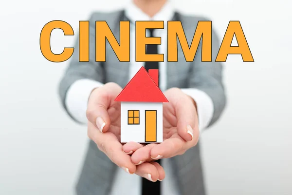 Hand writing sign Cinema. Business approach theater where movies are shown for public entertainment Movie theater Real Estate Agent Selling New Property, Architect Giving House Building Tip — Stock Photo, Image