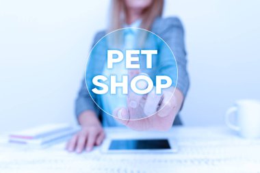 El yazısı tabelası Pet Shop. Yeni Smartphone Teknolojisi Sergilenen, Aygıt Geliştirmeleri Tartışan, kamuoyuna farklı hayvan türleri satan İnternet Konsepti Perakende Şirketi