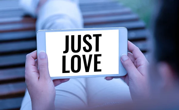 Ручной знак "Просто любовь". Обзор бизнеса физически заинтересован в ком-то эмоциональная привязанность Голос и видео, вызывающие возможности, соединяющие людей — стоковое фото