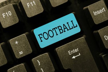 El yazısı metni futbol topu. Takım oyununun çeşitli şekillerinde kavramsal fotoğraf. Soyut Ofis Daktilo İşleri 'ni tekmelemek, Önemli İş Raporları yazmak...