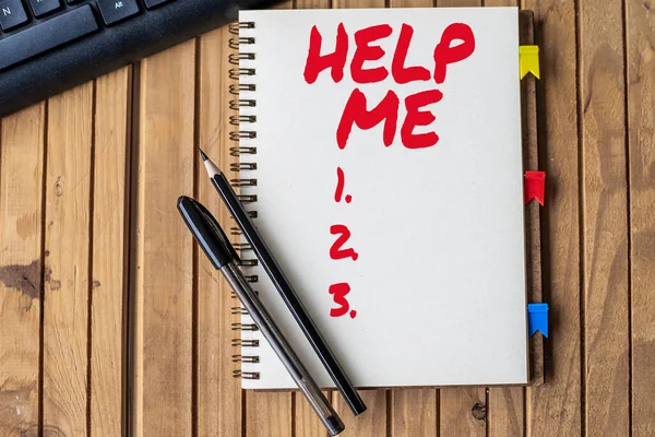 Text sign showing Help Me. Business concept Asking someone to assist you Shouting for it Teamwork Volunteer Empty Open Clipped Journal Beside Keyboard Pens On Top Of The Wooden Desk. — Stock Photo, Image