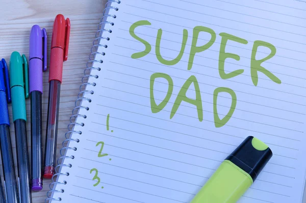 Text sign showing Super Dad. Word for Children idol and super hero an inspiration to look upon to Multiple Assorted Collection Office Stationery Photo Placed Over Table — Stock Photo, Image