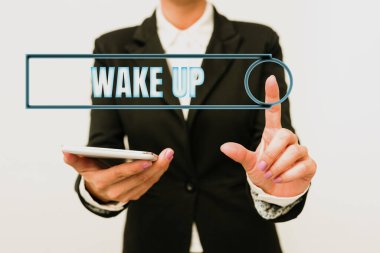 El yazısı işareti. Uyan. İş genel değerlendirmesi bir kişinin uyanması ya da uyanması Yeni Teknoloji Fikirlerini sunarak Teknolojik Gelişmeyi Tartışma